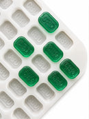 4 mL baksteen-gummivorm, 185 holtes — schuin bovenaanzicht met smaragdgroene CBD-gummies